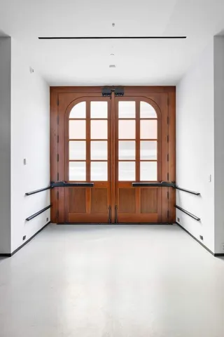 a car parked in front of a brick building