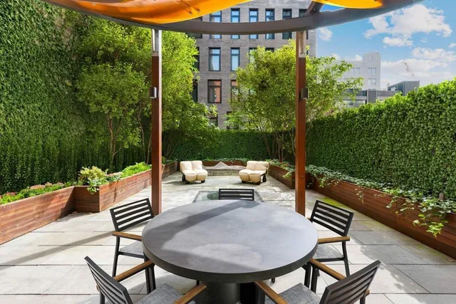 a kitchen with a table and chairs