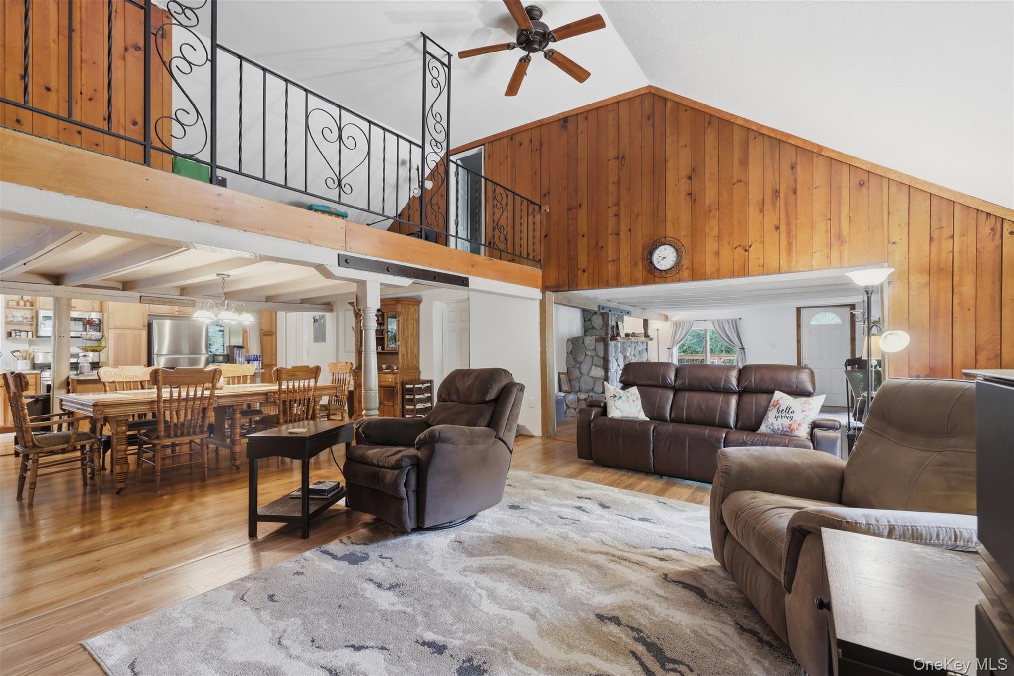 236 Hosner Mountain Road Hopewell Junction, NY 12533 - Photo 14 of 46 Spacious interior featuring a vaulted wood-paneling, wood-finish flooring, and a loft with decorative wrought iron railing