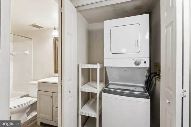 a bathroom with a toilet sink and a mirror