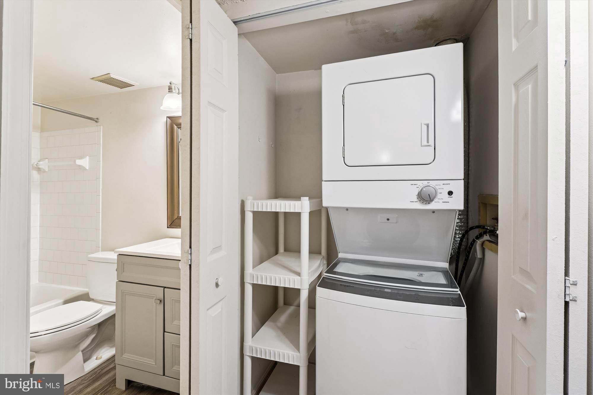 12129 Chaucer Lane, Unit 12129 Woodbridge, VA 22192 - Photo 14 of 31 a bathroom with a toilet sink and a mirror