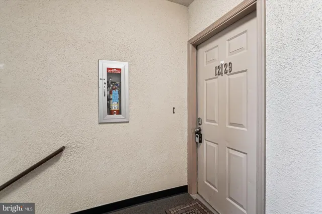 a view of a closet area with an empty room