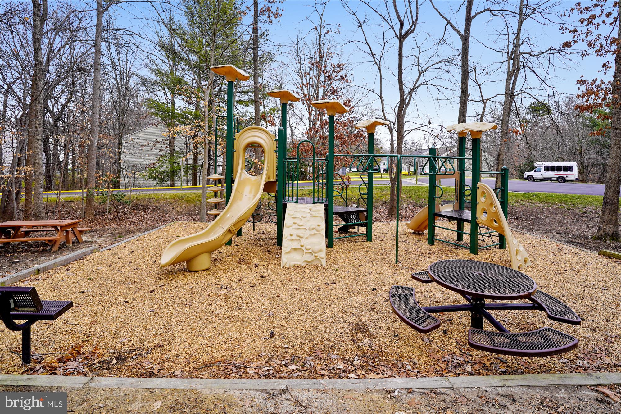 12129 Chaucer Lane, Unit 12129 Woodbridge, VA 22192 - Photo 22 of 31 a view of a park with swings and slides