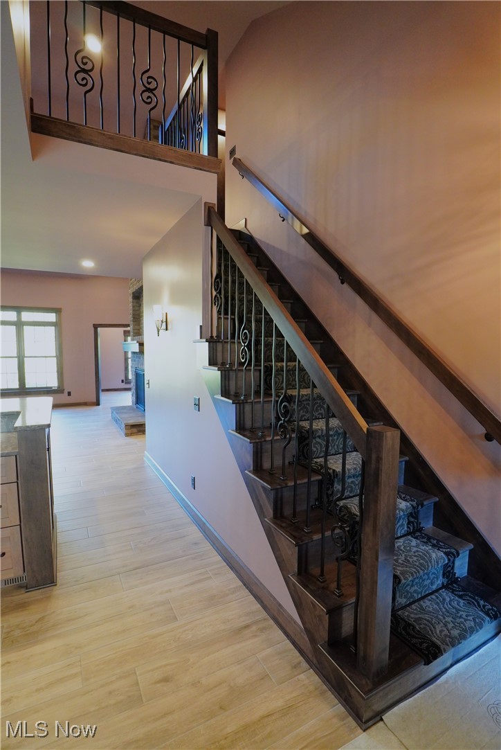 2502 Charing Cross Road Northwest Canton, OH 44708 - Photo 7 of 12 Staircase with wood flooring leads to loft and 2nd bedroom and bath