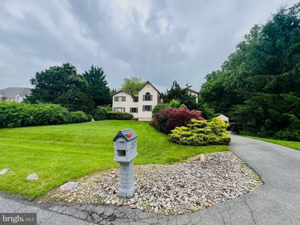 a front view of a house with a wooden fence