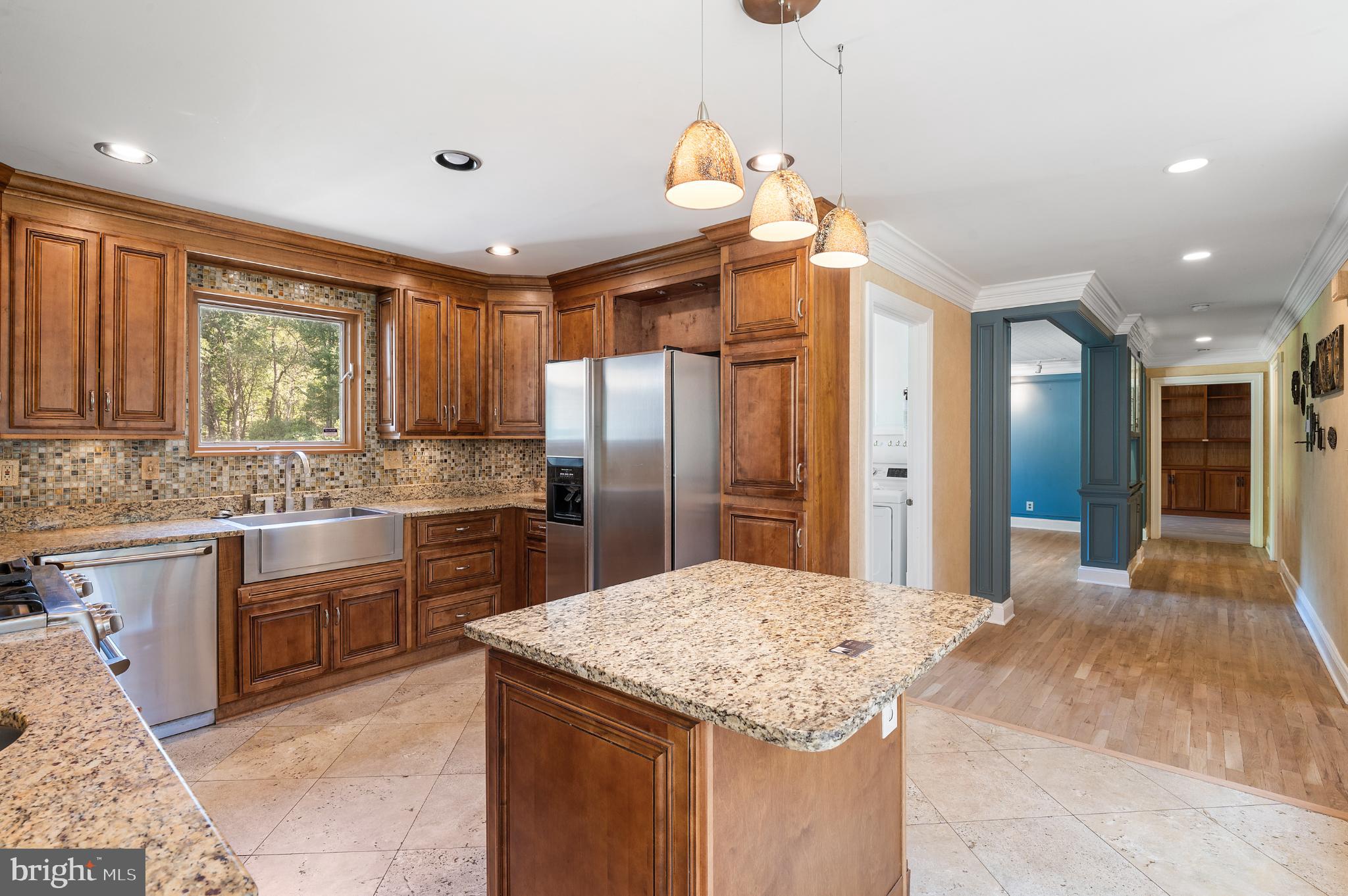 15729 Holly Grove Road Silver Spring, MD 20905 - Photo 12 of 83 Elegant kitchen with rich wood cabinetry.