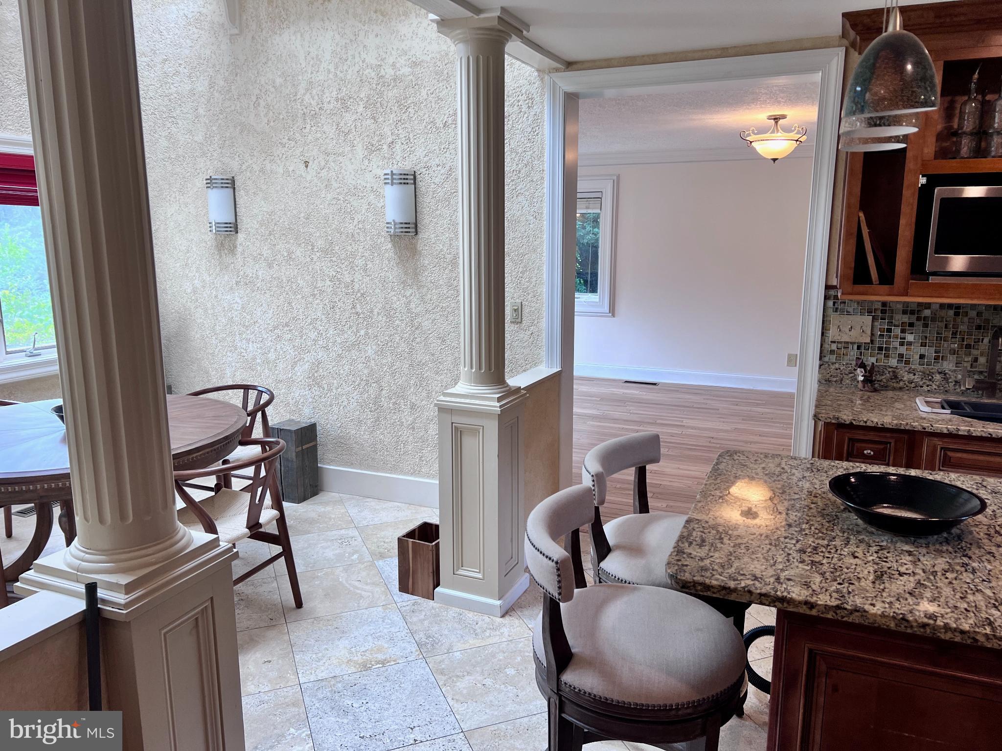 15729 Holly Grove Road Silver Spring, MD 20905 - Photo 17 of 83 a bathroom with a granite countertop sink a toilet and a mirror