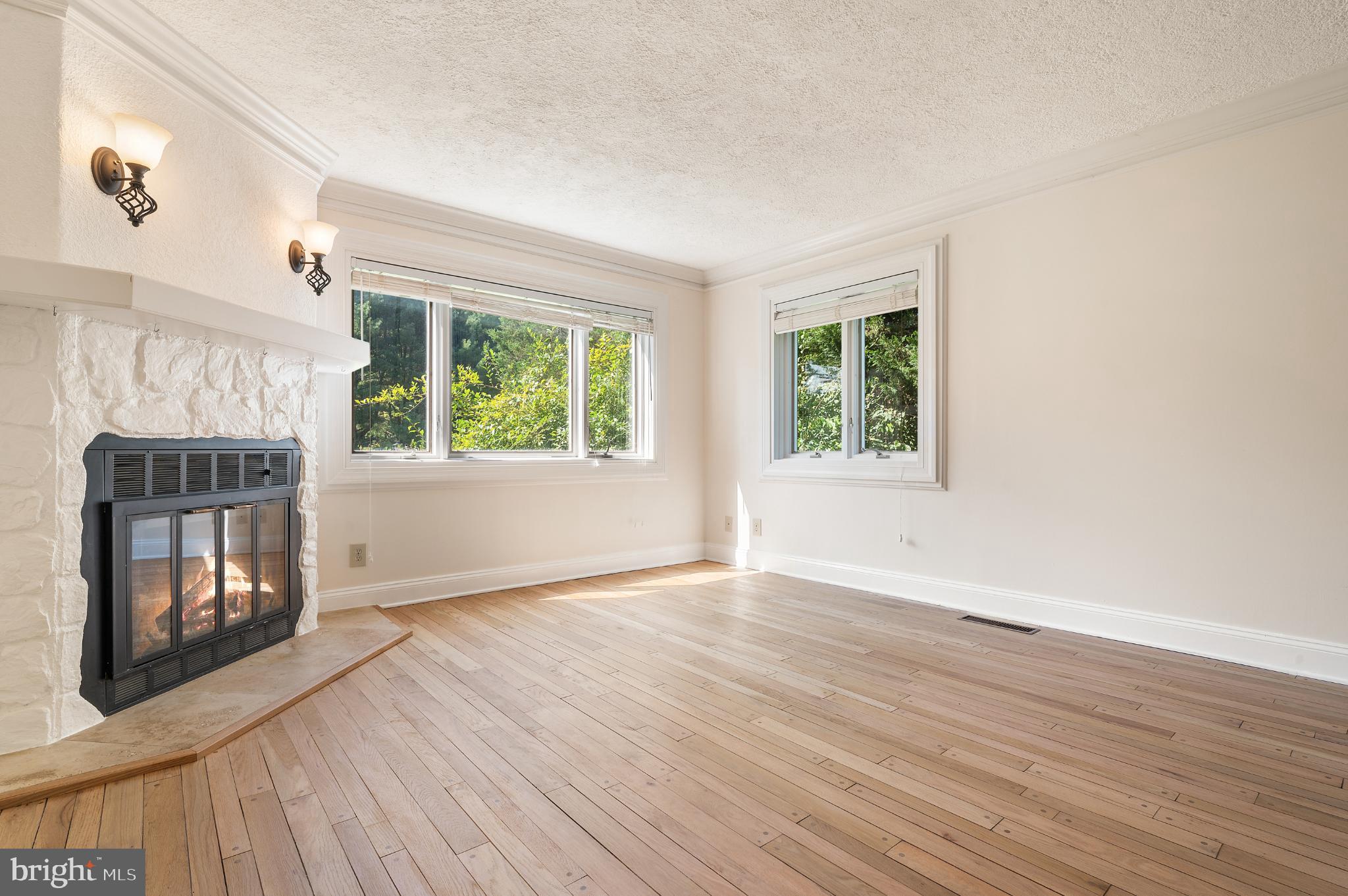 15729 Holly Grove Road Silver Spring, MD 20905 - Photo 27 of 83 a view of an empty room with wooden floor and a window