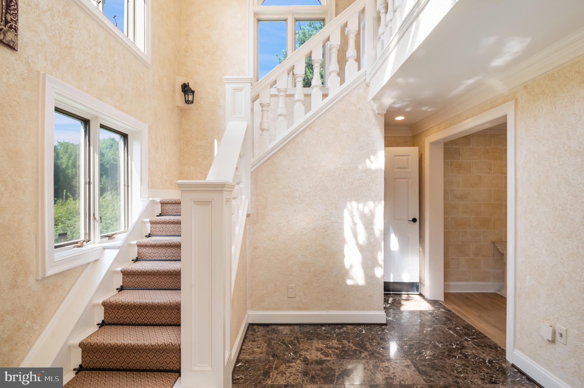 15729 Holly Grove Road Silver Spring, MD 20905 - Photo 40 of 83 a view of entryway and hall with wooden floor