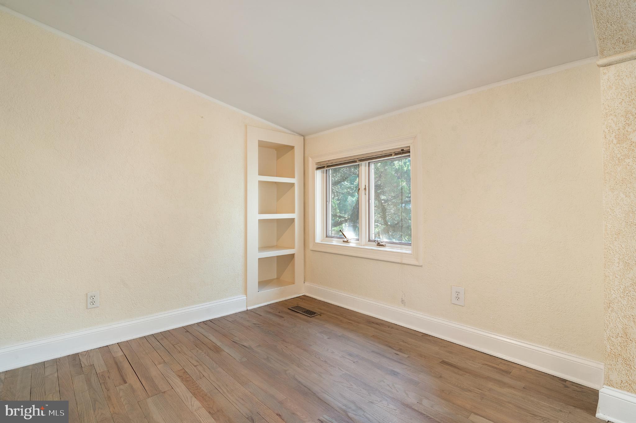 15729 Holly Grove Road Silver Spring, MD 20905 - Photo 43 of 83 an empty room with wooden floor and windows