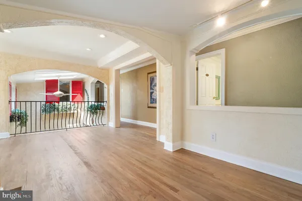 a view of staircase with white walls and railing