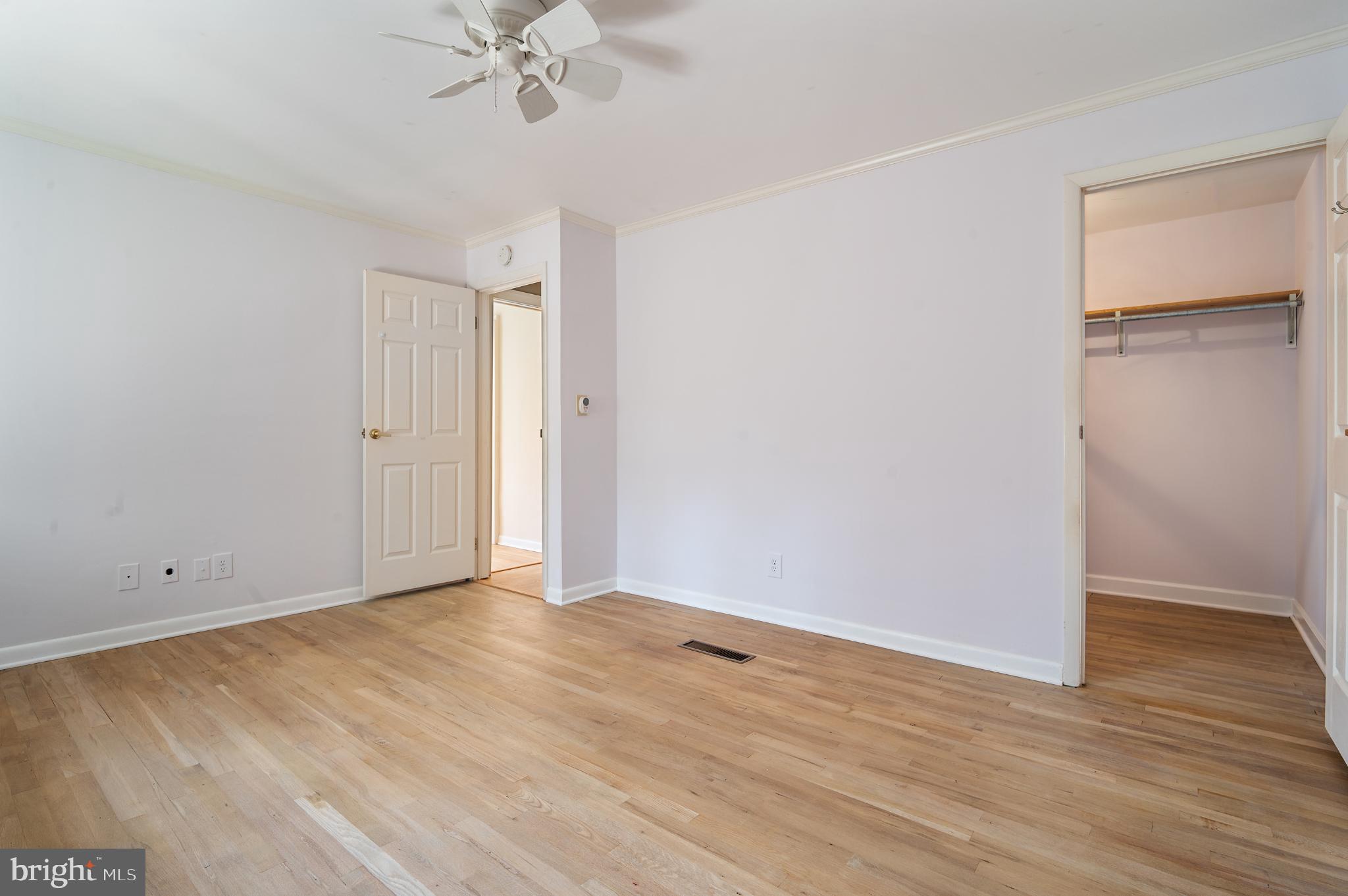 15729 Holly Grove Road Silver Spring, MD 20905 - Photo 57 of 83 a view of an empty room with wooden floor
