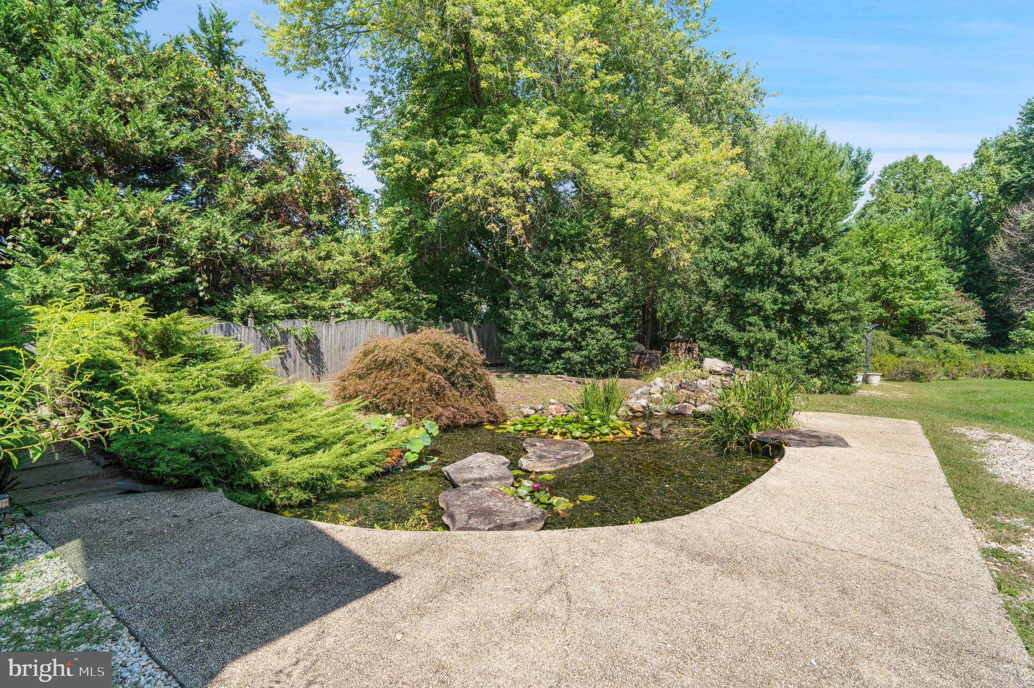 15729 Holly Grove Road Silver Spring, MD 20905 - Photo 64 of 83 Serene garden oasis with tranquil pond.