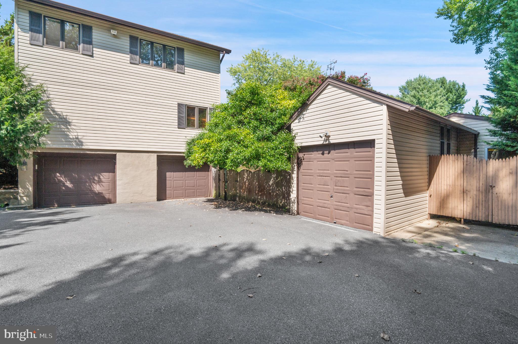 15729 Holly Grove Road Silver Spring, MD 20905 - Photo 67 of 83 a view of a house with a yard and garage