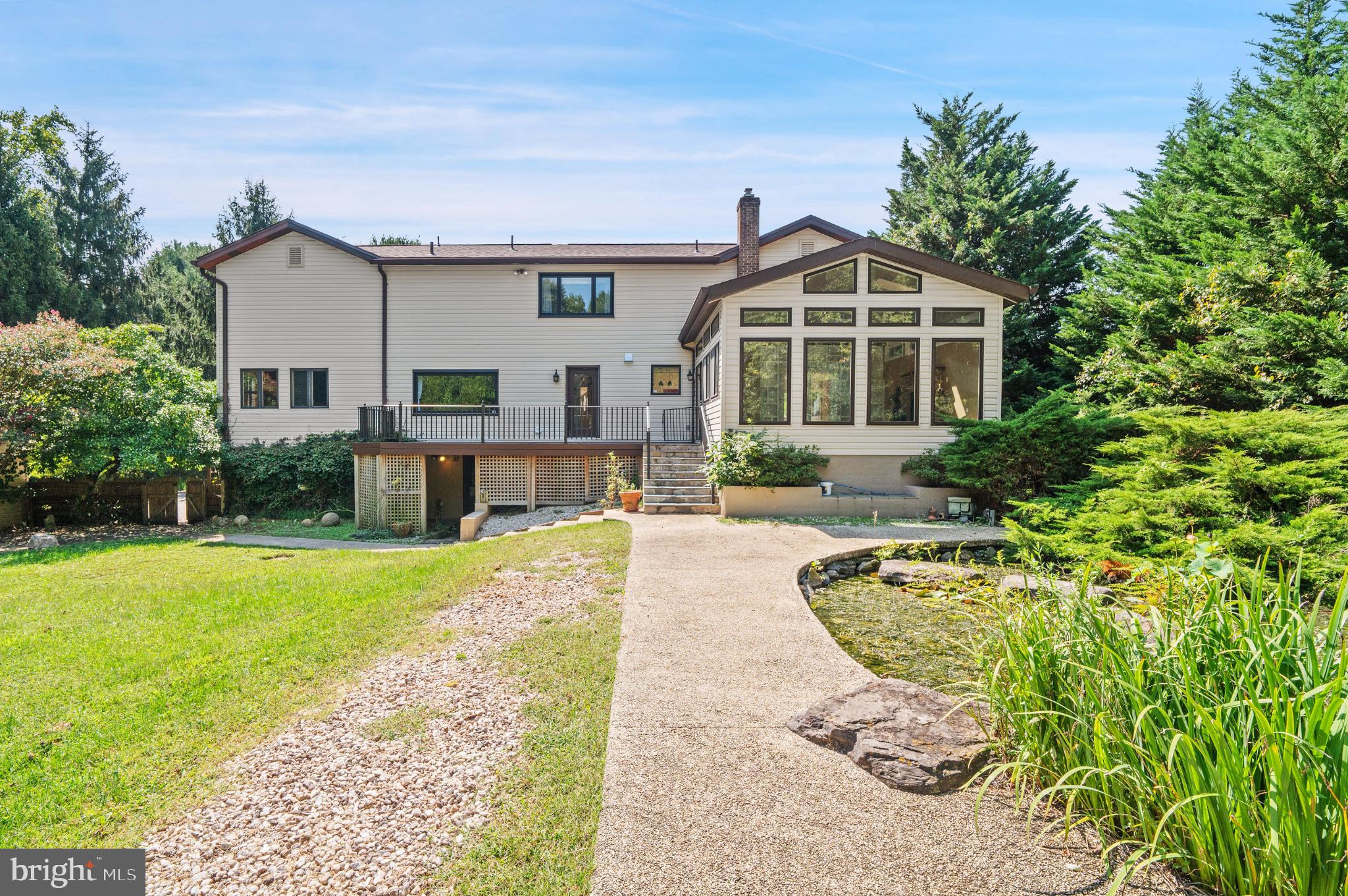 15729 Holly Grove Road Silver Spring, MD 20905 - Photo 68 of 83 a front view of a house with garden