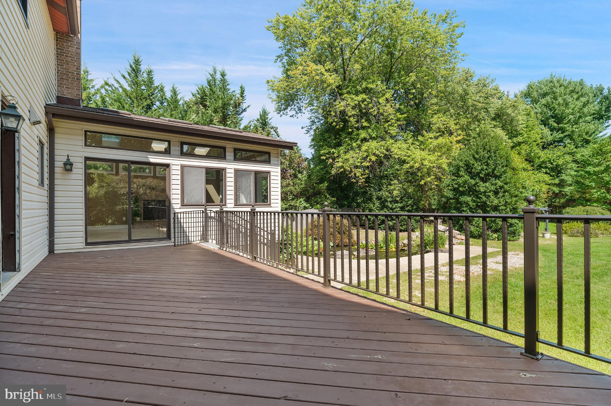 15729 Holly Grove Road Silver Spring, MD 20905 - Photo 78 of 83 a view of backyard with deck and outdoor seating