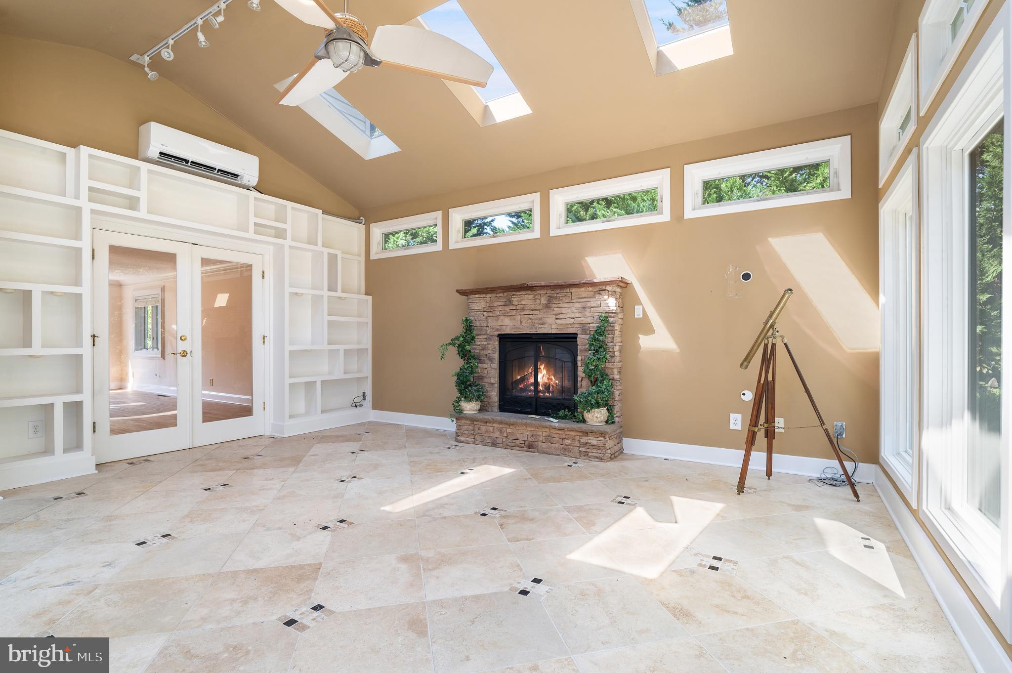 15729 Holly Grove Road Silver Spring, MD 20905 - Photo 79 of 83 Bright and airy space with a cozy fireplace.