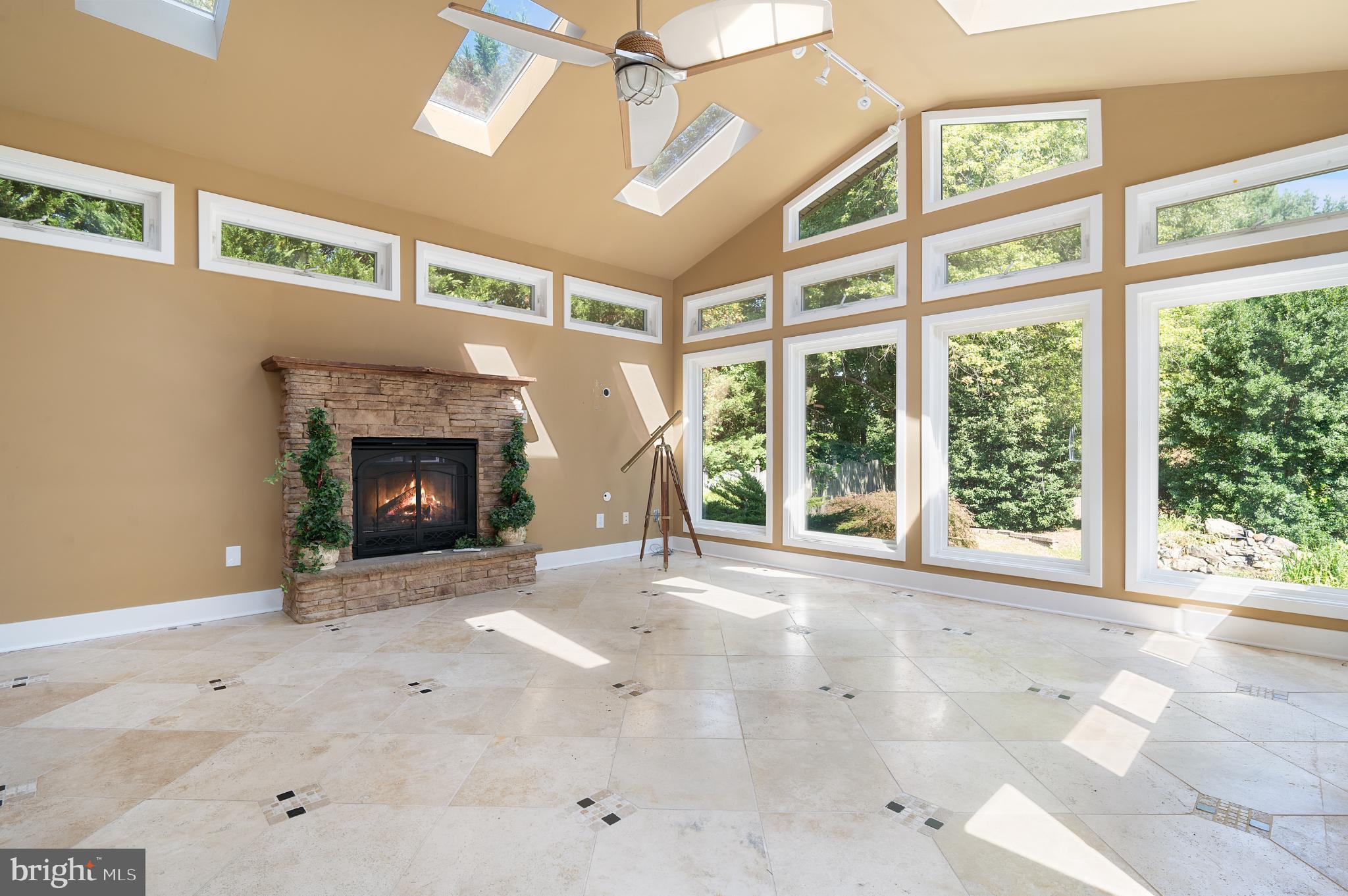 15729 Holly Grove Road Silver Spring, MD 20905 - Photo 80 of 83 a view of an empty room with a fireplace and a window