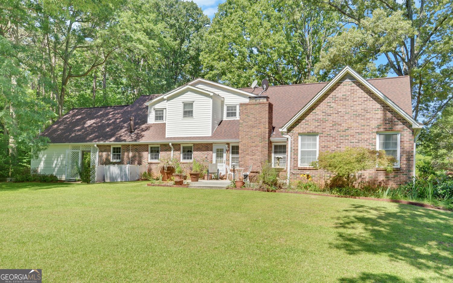 400 Harris Street Toccoa, GA 30577 - Photo 40 of 49 a front view of a house with a yard and garage