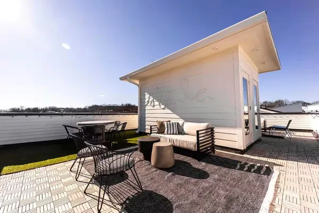a terrace of a house with outdoor seating