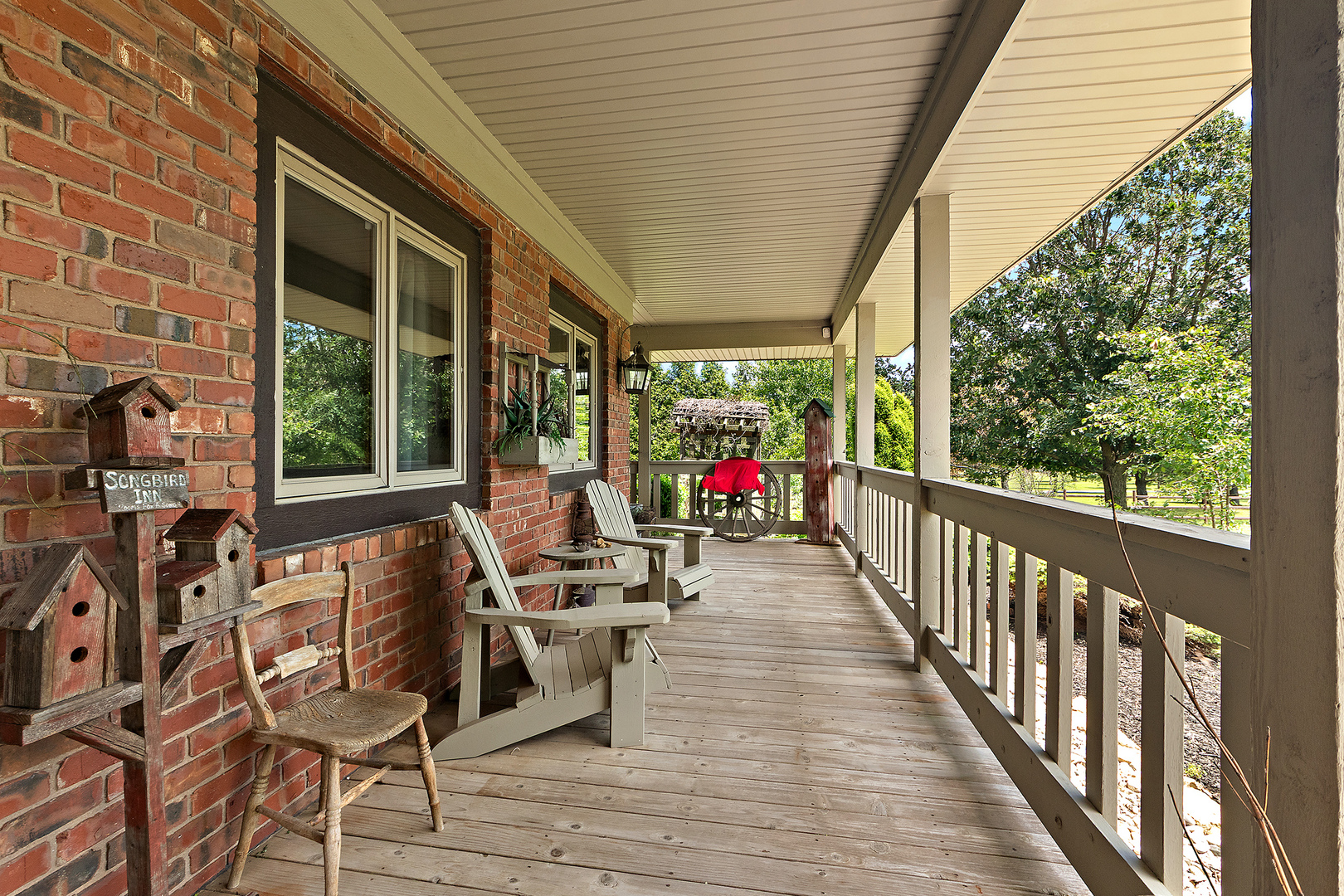 7860 West Steger Road Frankfort, IL 60423 - Photo 5 of 56 a view of a patio with table and chairs potted plants with wooden floor and floor to ceiling window
