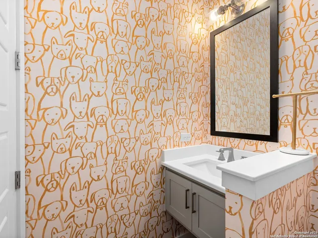 a bathroom with a sink and a mirror