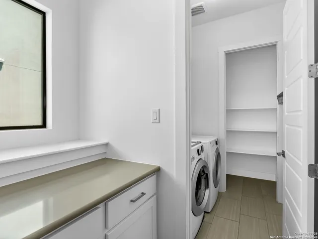 a utility room with a washer and dryer