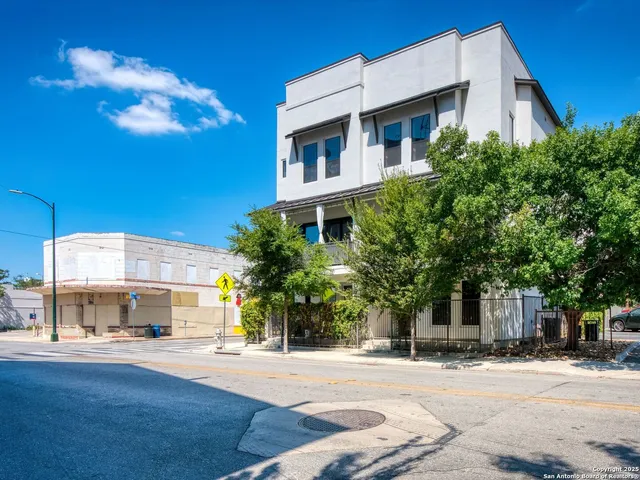 a front view of a building with a street