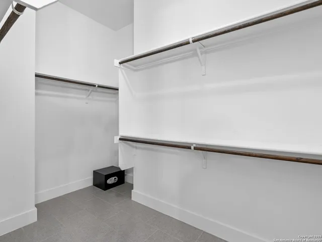 a view of a room with an empty walk in closet