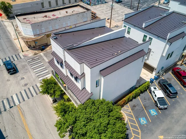 a view of a patio with table and chairs with wooden floor and fence