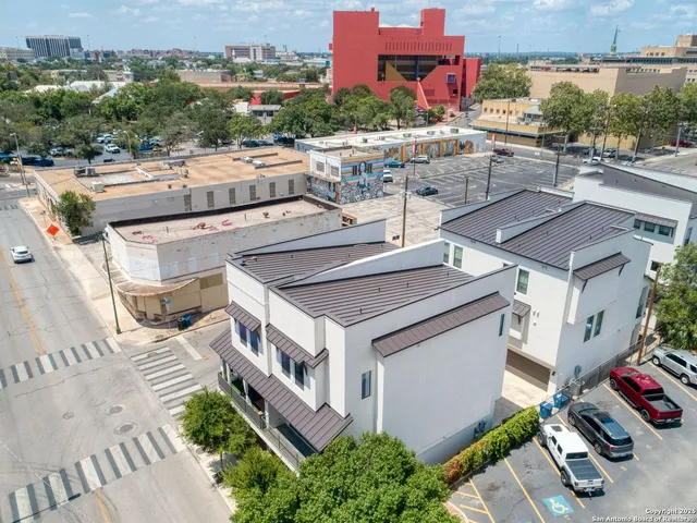 an aerial view of a house with a garden space