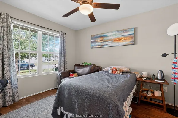 a bedroom with bed and a window