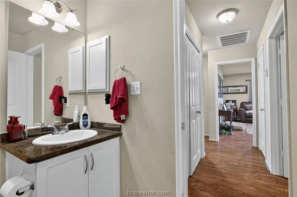 a en suite bathroom with a sink and a mirror
