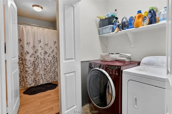 a utility room with dryer and washer