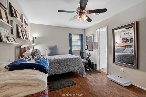 a bedroom with a bed and window