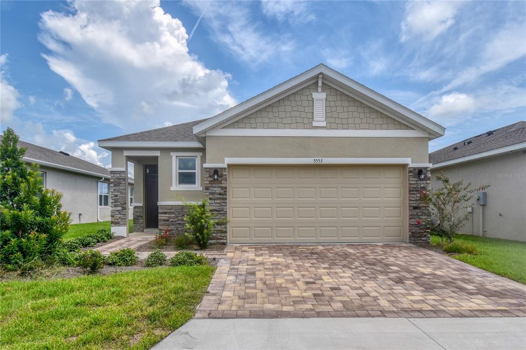 5553 Northwest 40th Loop Ocala, FL 34482 - Photo 1 of 1 a front view of house with yard