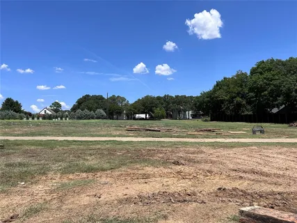a view of a lake with a yard