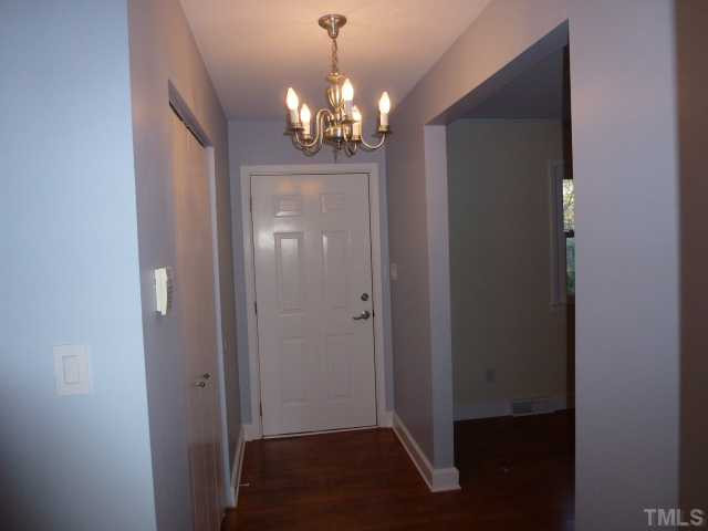 1714 Euclid Road Durham, NC 27713 - Photo 3 of 25 a view of a hallway with chandelier and closet area