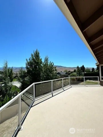 3639 Ridgeview Boulevard Wenatchee, WA 98801 - Photo 12 of 36 a view of a swimming pool with a balcony