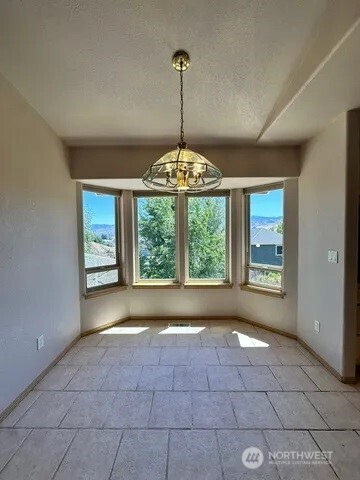 3639 Ridgeview Boulevard Wenatchee, WA 98801 - Photo 13 of 36 a view of an empty room with windows