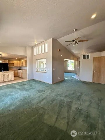 3639 Ridgeview Boulevard Wenatchee, WA 98801 - Photo 8 of 36 a view of a big room with windows and cabinet