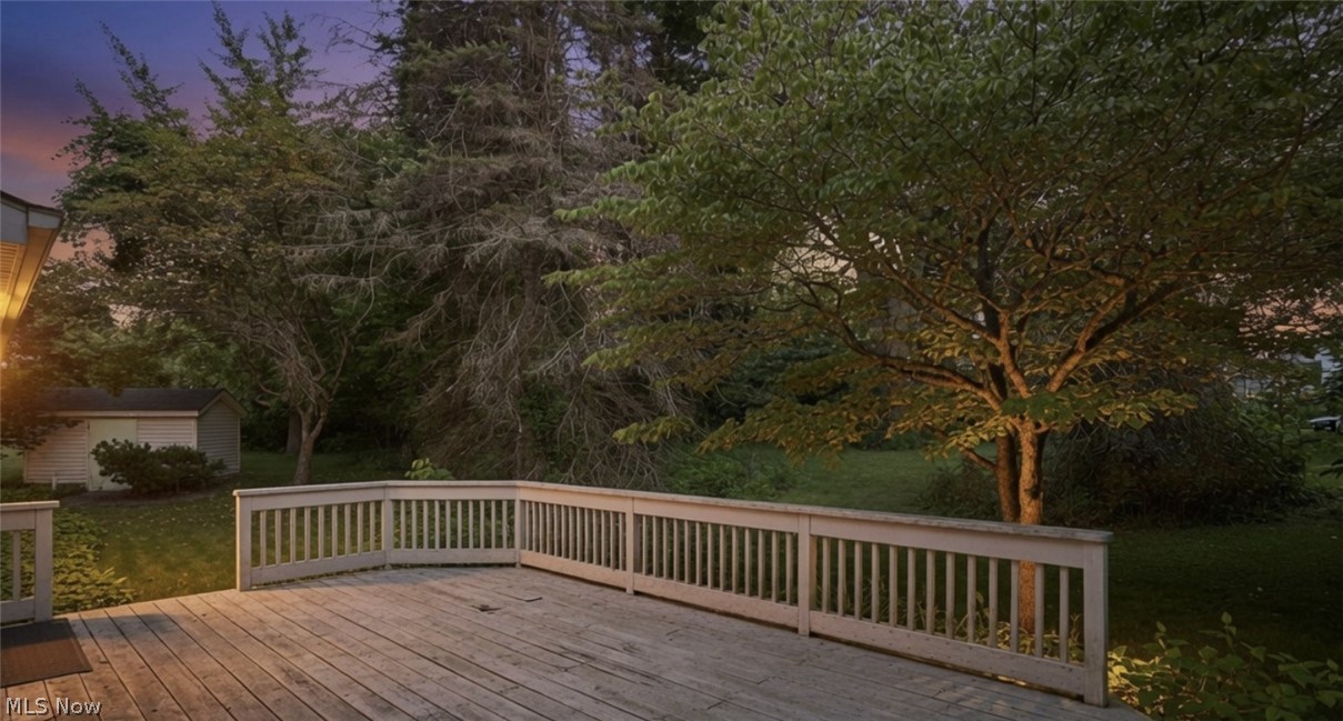 299 West Caston Road New Franklin, OH 44319 - Photo 5 of 23 Expansive wood-finish deck with a perimeter railing