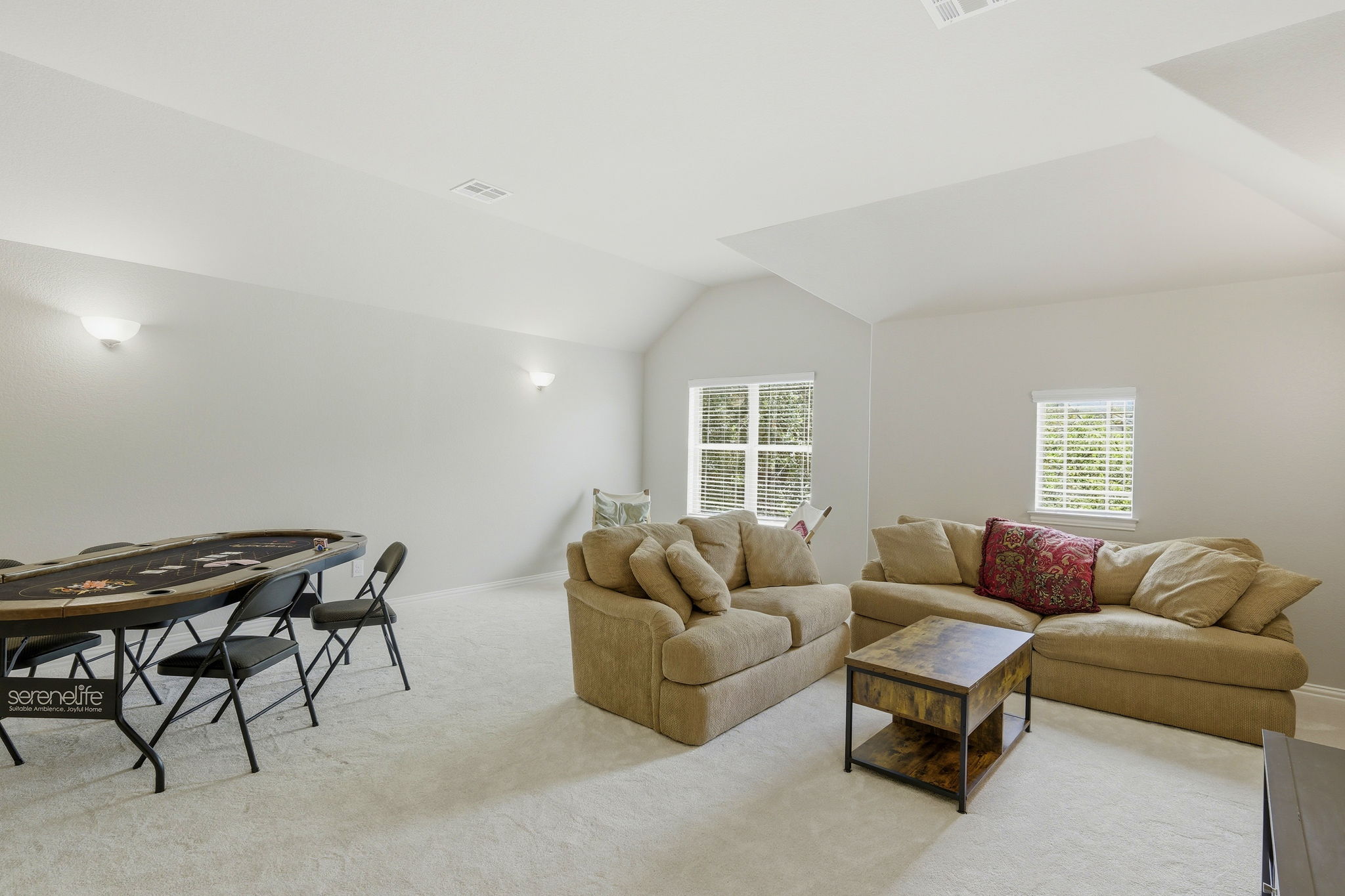 110 Dasher Drive Cedar Park, TX 78613 - Photo 28 of 39 A spacious recreation room offers comfortable lounging and a designated area for games, perfect for entertaining.