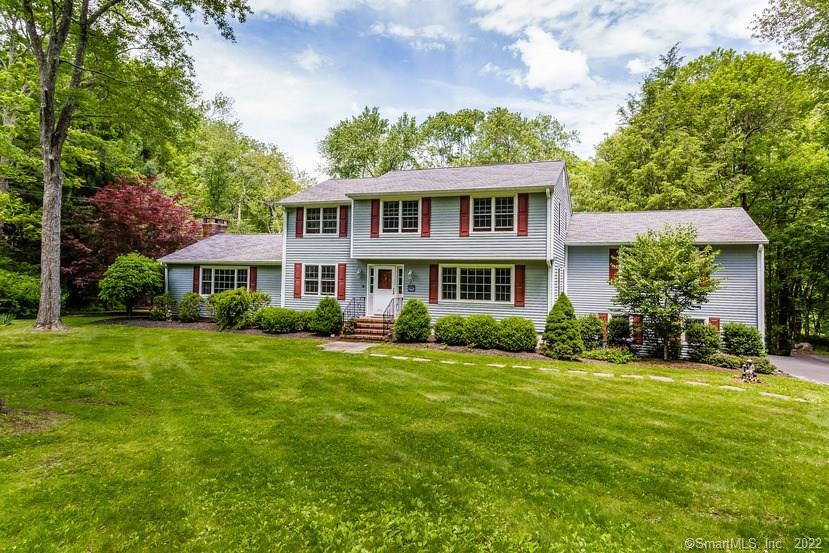 39 Arapaho Road Brookfield, CT 06804 - Photo 1 of 1 a front view of a house with a garden
