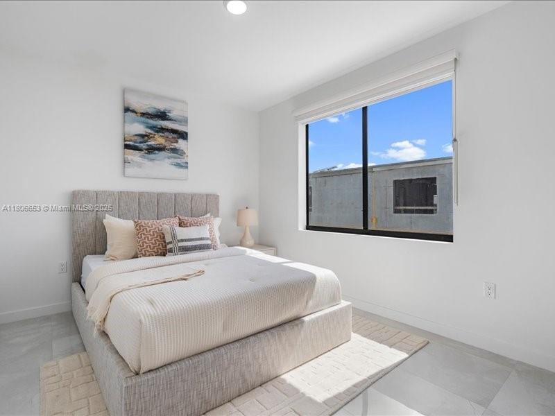 14608 Southwest 261st Terrace Homestead, FL 33032 - Photo 21 of 26 a bedroom with a bed and a window