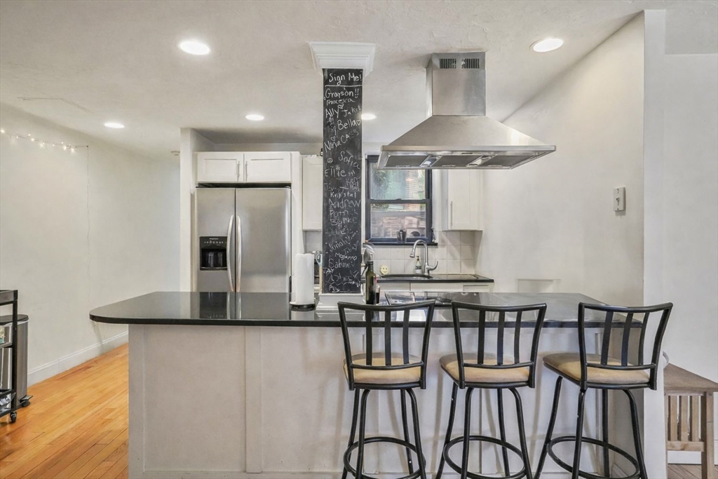 a kitchen with a table and chairs in it