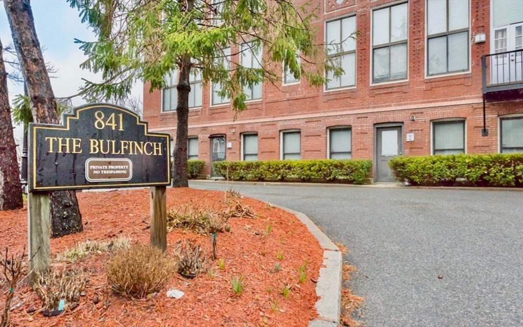 841 Parker Street, Unit 101 Boston, MA 02120 - Photo 18 of 19 a view of sign board with buildings in the background