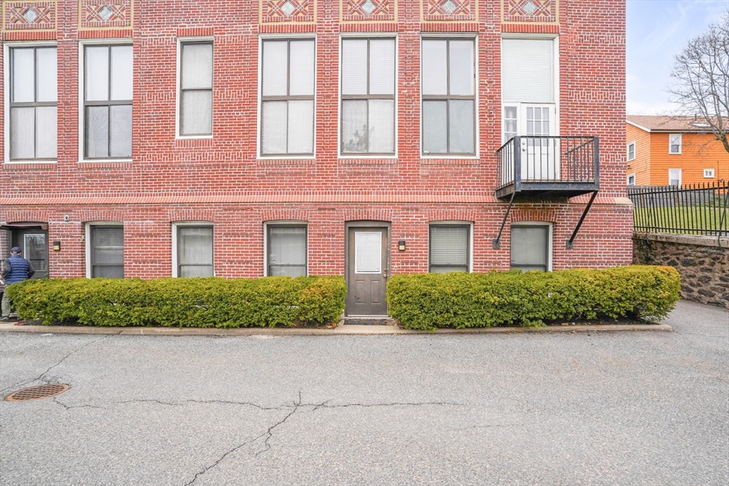 841 Parker Street, Unit 101 Boston, MA 02120 - Photo 19 of 19 front view of a brick house