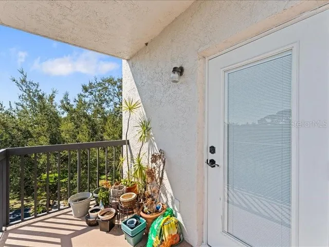 a view of a balcony with furniture