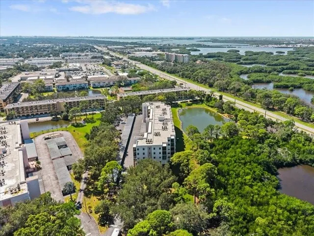 an aerial view of a house with a lake view